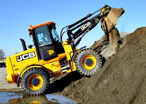 U.S. Air Force Airman 1st Class Brandon Ritenour, 633rd Civil Engineer Squadron heavy equipment operator, empties a loader at Langley Air Force Base, Va., Jan. 9, 2015. Heavy equipment operators are often referred to as “Dirt Boys” because of the messy nature of their job. Ritenour said “Dirt Boy” is a term of endearment he takes pride in, because it signifies the hard work he and his team put into making the mission possible. (U.S. Air Force photo by Airman 1st Class Devin Scott Michaels/Released)
