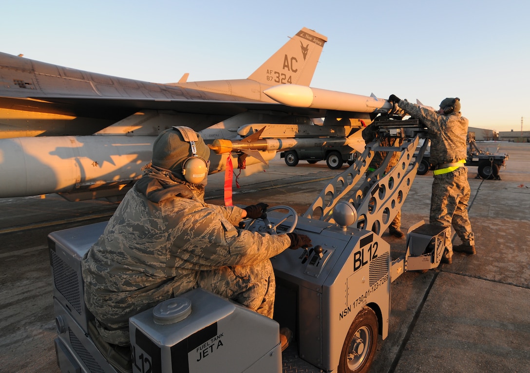 U.S. Air Force Airmen from the New Jersey Air National Guard's 177th Fighter Wing in Egg Harbor Township, N.J., unload munitions from an F-16C Fighting Falcon on Jan. 9, 2015. The Airmen participate in an aircraft generation exercise that test the readiness of the ground and flight crews. (U.S. Air Force photo by Airman 1st Class Amber Powell/Released)