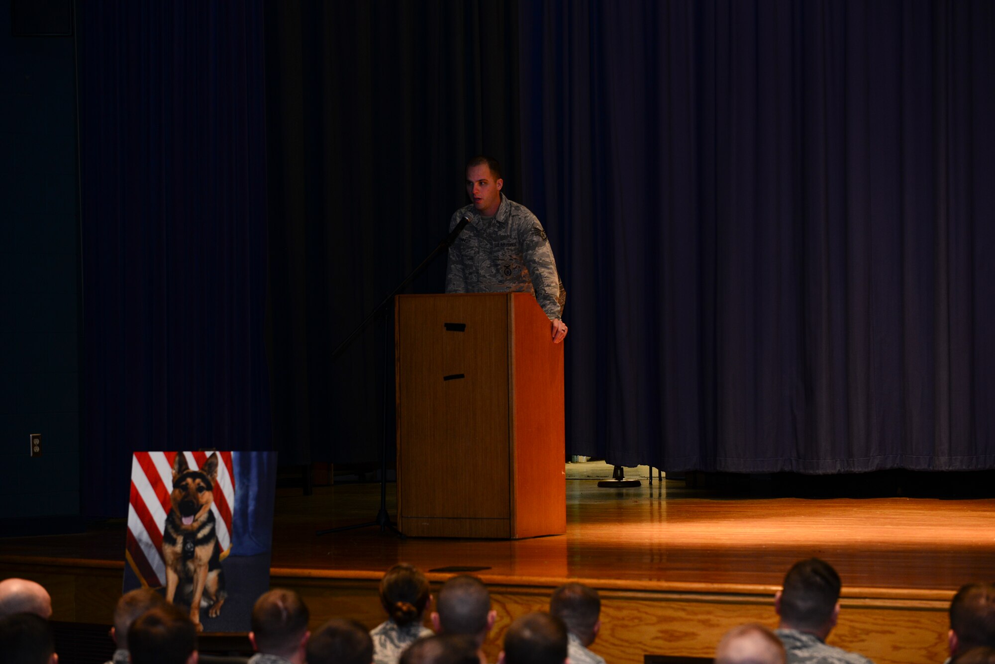 U.S. Air Force Staff Sgt. Jeffrie Kennedy, 633rd Security Forces Squadron Military Working Dog handler, presents the eulogy during a MWD memorial ceremony at Langley Air Force Base, Va., Jan. 8, 2015. Erdo M614, former 633rd SFS MWD, deployed once within his seven-year career. (U.S. Air Force photo by Staff Sgt. Natasha Stannard/Released)