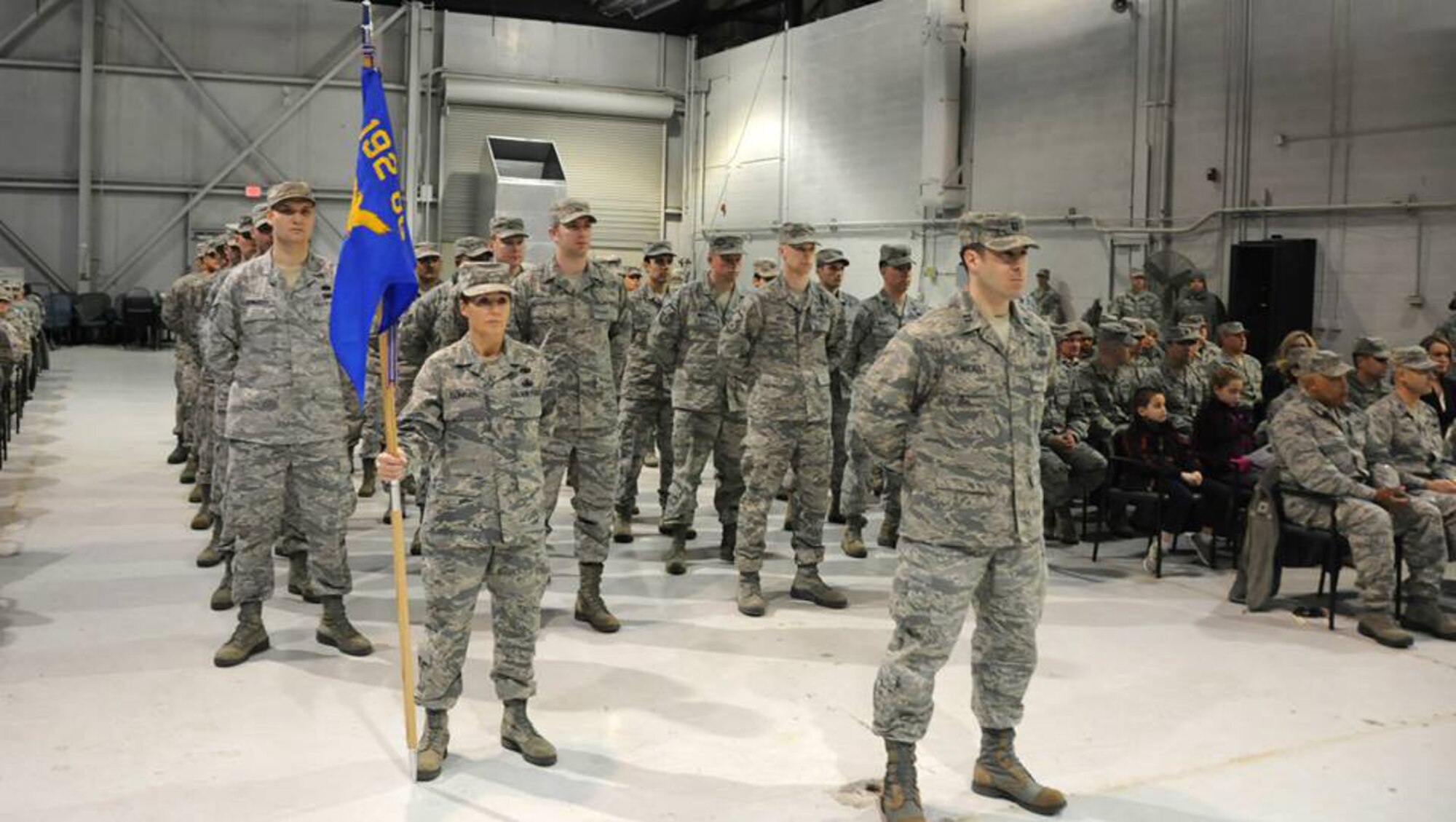 Lt. Col. Thomas McAtee, 192nd Operations Group Commander, presents the unit guidon for the 192nd Intelligence Squadron to Lt. Col. David R. Lands, signifying his assumption of command of the unit, during a change of command ceremony held Jan. 10 at Joint Base Langley-Eustis, Va. Lands assumed command from Lt. Col. Bryan E. Salmon who recently assumed a new role as the Air National Guard Advisor to the 480th Intelligence Surveillance Reconnaissance Wing. (U. S. Air Force photo by Tech. Sgt. Meghan Skrepenski, Virginia Air National Guard Public Affairs/RELEASED)