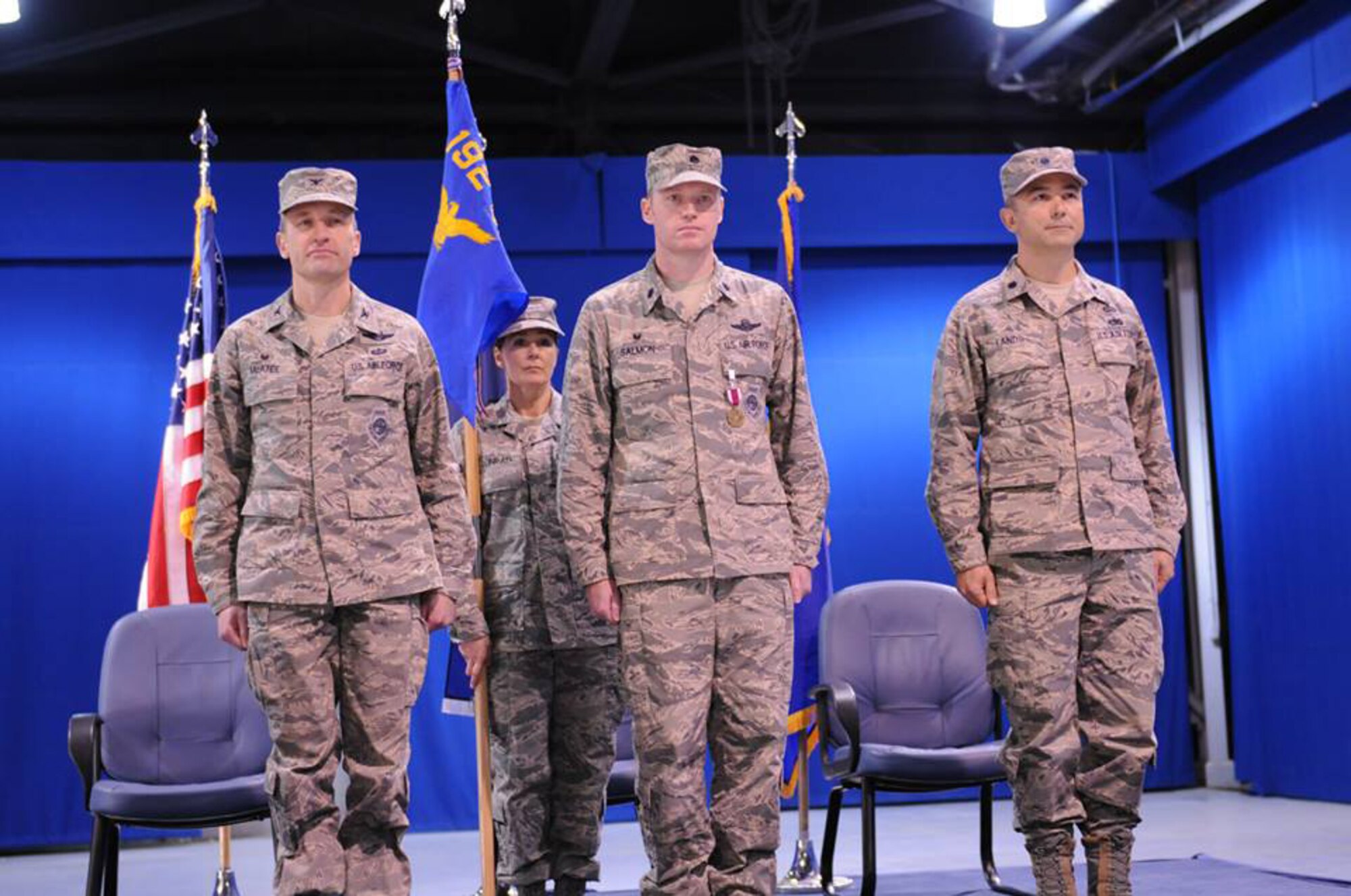 Lt. Col. Thomas McAtee, 192nd Operations Group Commander, presents the unit guidon for the 192nd Intelligence Squadron to Lt. Col. David R. Lands, signifying his assumption of command of the unit, during a change of command ceremony held Jan. 10 at Joint Base Langley-Eustis, Va. Lands assumed command from Lt. Col. Bryan E. Salmon who recently assumed a new role as the Air National Guard Advisor to the 480th Intelligence Surveillance Reconnaissance Wing. (U. S. Air Force photo by Tech. Sgt. Meghan Skrepenski, Virginia Air National Guard Public Affairs/RELEASED)
