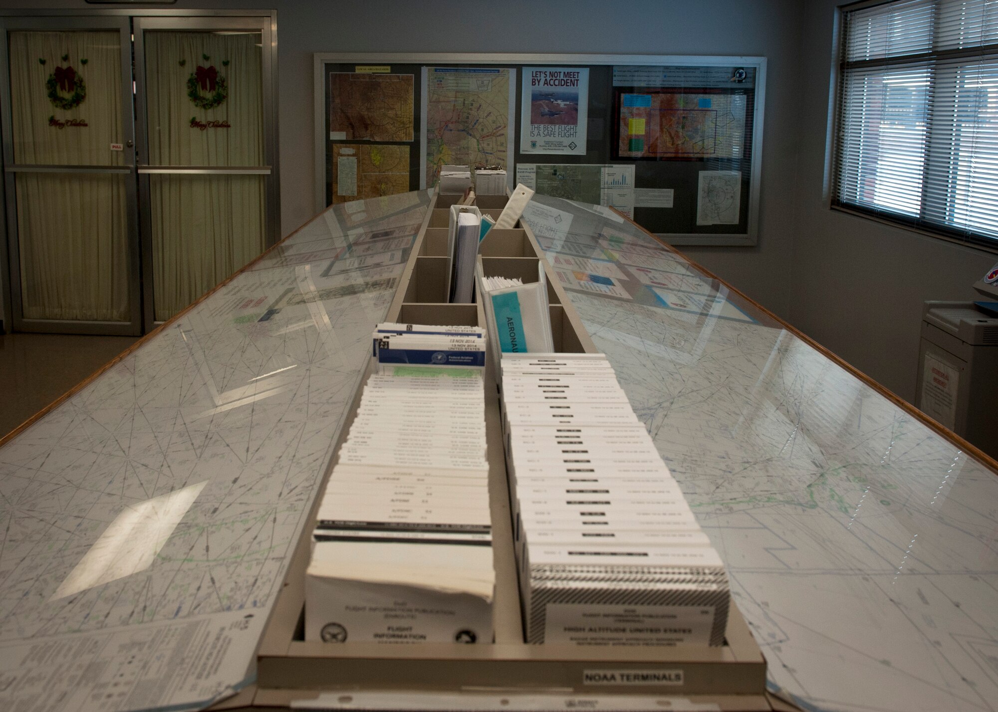 PETERSON AIR FORCE BASE, Colo. – The flight planning room is equipped with anything pilots and their crews could possibly need to create new flight plans after stopping at Peterson’s base operations. Airfield management is responsible for the safety of all incoming and outgoing aircraft and their crews, ranging from inspecting and maintaining the runways, taxiways and aprons of the airfield to responding to in-flight emergencies and coordinating with other base agencies to make aircrews’ stays as efficient as possible. (U.S. Air Force photo by Airman 1st Class Rose Gudex)