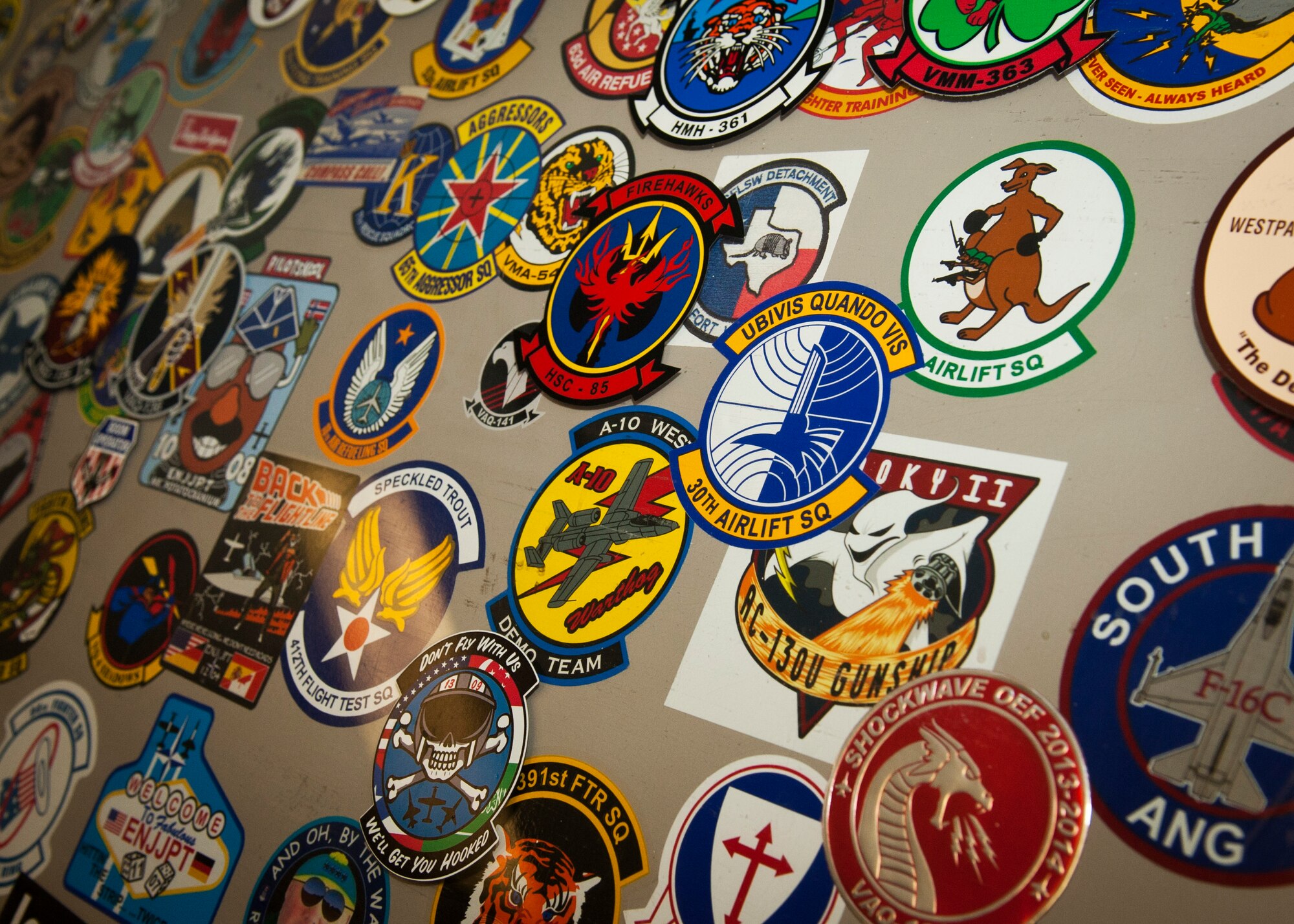 PETERSON AIR FORCE BASE, Colo. – Many pilots and crews that pass through Peterson add their unit patch to the collection displayed in the flight planning room at Peterson’s base operations. Airfield management is responsible for the safety of all incoming and outgoing aircraft and their crews, ranging from inspecting and maintaining the runways, taxiways and aprons of the airfield to responding to in-flight emergencies and coordinating with other base agencies to make aircrews’ stays as efficient as possible. (U.S. Air Force photo by Airman 1st Class Rose Gudex)