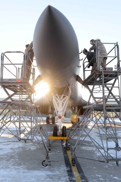 Airmen from the 28th Maintenance Squadron perform maintenance on a B-1 bomber prior to take-off at Ellsworth Air Force Base, S.D., Jan. 7, 2015. Airmen from the 28th MXS work throughout various weather conditions yearlong to keep all B-1s on Ellsworth mission ready. (U.S. Air Force photo by Airman 1st Class Rebecca Imwalle/Released)
