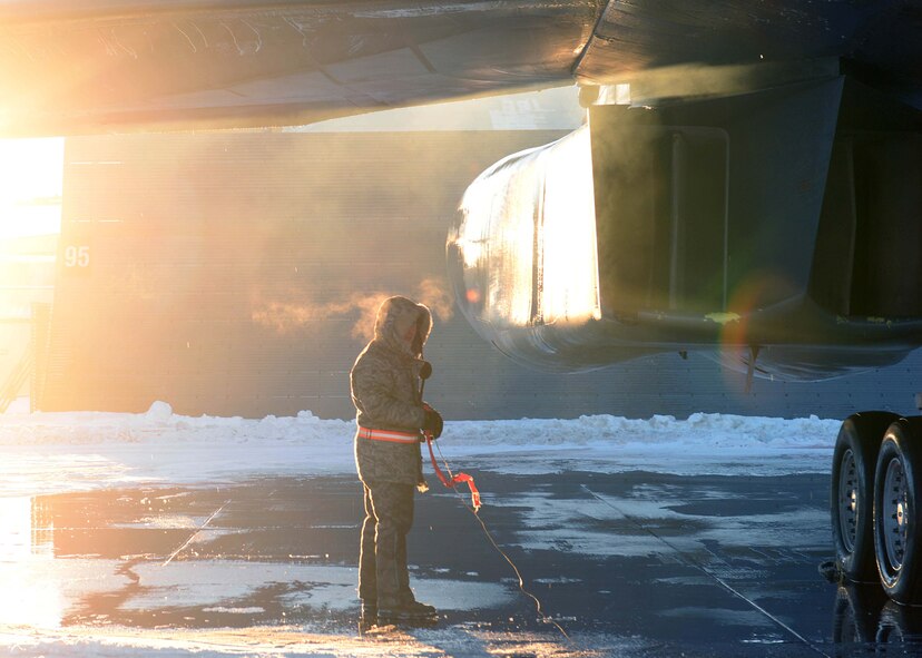 Airman 1st Class Michael Campbell, 28th Aircraft Maintenance Squadron crew chief, works in below freezing temperatures on the flightline at Air Force Base, S.D., Jan. 7, 2015. Each day, Airmen work in severe weather conditions to ensure Ellsworth’s mission is completed without interruption. (U.S. Air Force photo by Airman 1st Class Rebecca Imwalle/Released)