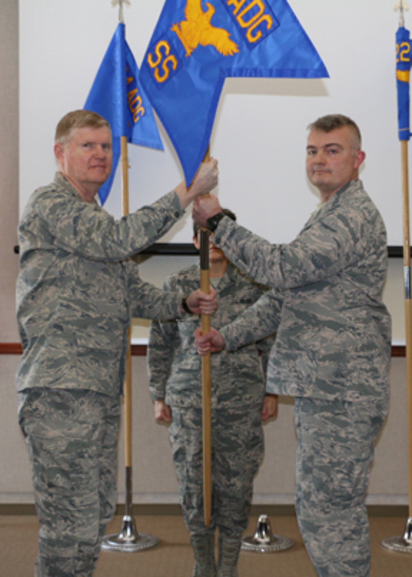 Maj. Gen. Verle Johnston, Commander, New York Air National Guard, passes the 224th Support Squadron guidon to Col. Emil Filkorn, who assumed command of the squadron at a Jan. 10 activation ceremony.