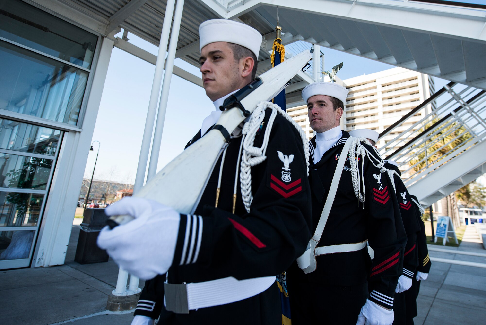 Joint Base Charleston-Weapons Station Honor Guard stand in position in preparation of the USS Charleston ship-naming ceremony Jan. 9, 2015, at the Maritime Center in Charleston, S.C.  The USS Charleston will be part of the Littoral Combat Ship fleet and is a fast, agile, focused-mission platform designed for operation in near-shore environments and is capable of open-ocean operations. It is designed to defeat asymmetric "anti-access" threats such as mines, quiet diesel submarines and fast surface craft. (U.S. Air Force photo by Tech Sgt. Rasheen Douglas)