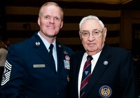 Army Air Corp Staff Sgt. William Hughey poses for a photo with Chief Master Sgt. of the Air Force James A. Cody at the Atlanta Regional Military Affairs Council luncheon Nov. 17, 2014 in Cobb County, Georgia. Hughey was a ball turret gunner for the B-17 and was awarded the Army Good Conduct Medal for his service Jan. 10, 2015. (U.S. Air Force photo/Senior Airman Daniel Phelps
