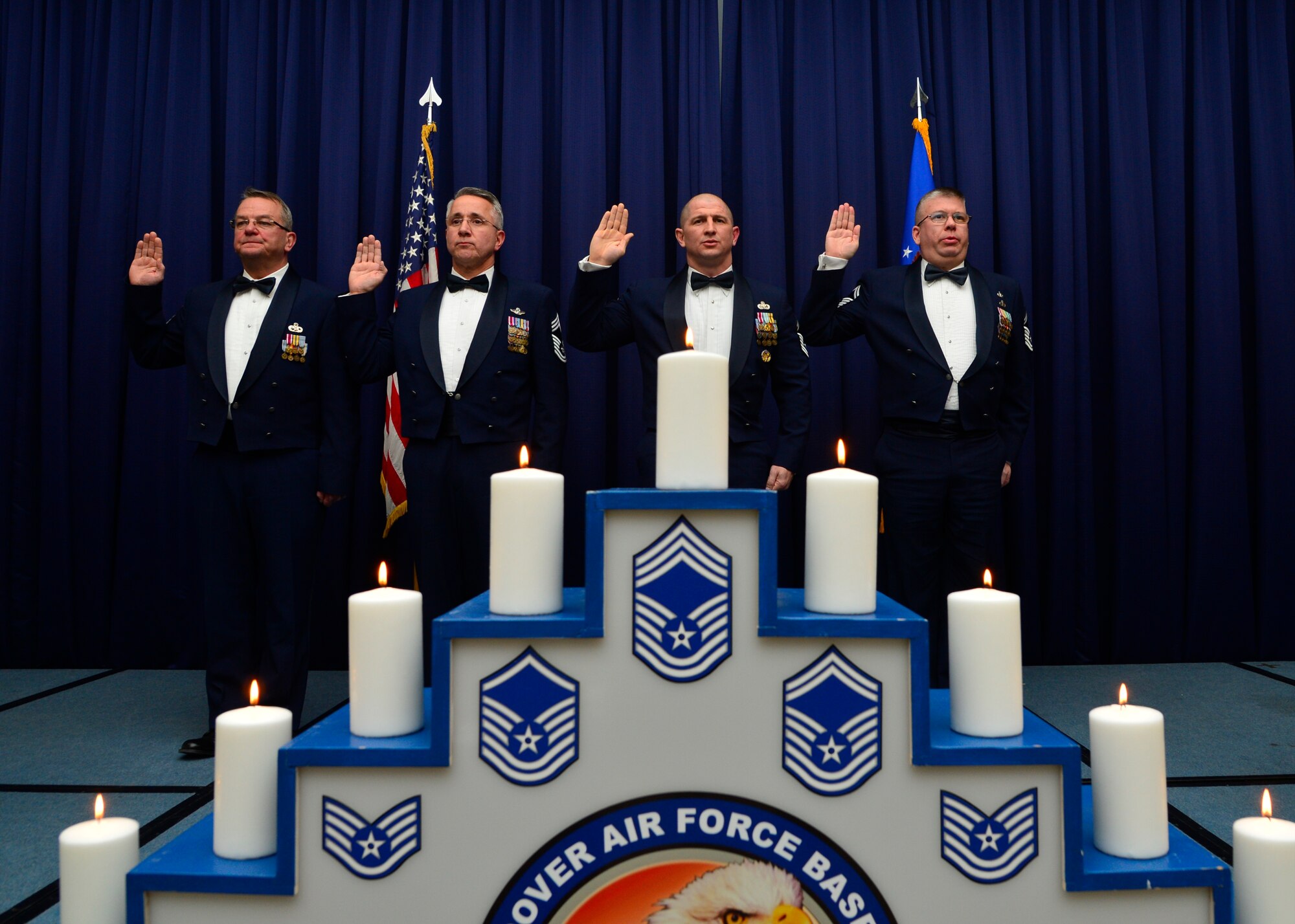 Team Dover’s newest chief master sergeants and chief master sergeant-selects recite the Chief’s Charge during a recognition banquet Jan. 10, 2015, at the Landings Club on Dover Air Force Base, Del. The banquet was hosted by the Dover Air Force Base Chief’s Group. (U.S. Air Force photo/Airman 1st Class William Johnson)