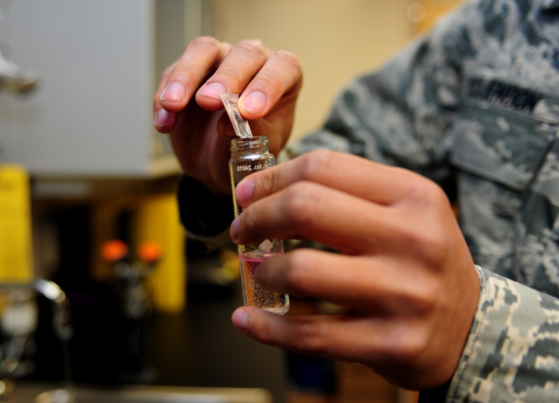 U.S. Air Force Airman 1st Class Alex McClendon, 633rd Aerospace Medicine Squadron bioenvironmental engineer technician, performs a water quality check at Langley Air Force, Va., Jan. 9, 2015. The 633rd AMDS Bioenvironmental Office performs daily checks on water samples from base to ensure safe for use. (U.S. Air Force photo by Airman 1st Class Areca T. Wilson/Released) 