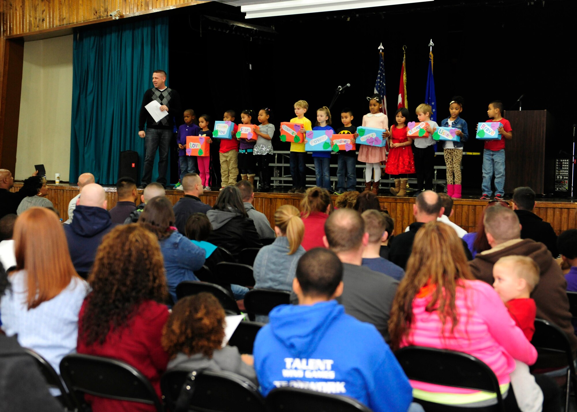 Chad Cascani, teacher, and his class of kindergarteners perform a presentation on what they learned while reading about Dr. Martin Luther King Jr. during an annual MLK observance luncheon Jan. 10, 2015, Incirlik Air Base, Turkey. The event featured presentations from several Incirlik Air Base elementary school classes and the Incirlik AB elementary honor’s choir. (U.S. Air Force photo by Senior Airman Krystal Ardrey/Released)