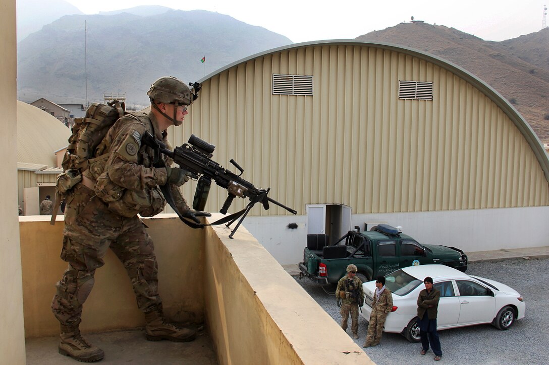 A U.S. soldier provides security from an elevated position at the Khyber Border Coordination Center near Torkham Gate at the Afghanistan-Pakistan border in Afghanistan's Nangarhar province, Jan. 4, 2015. The soldier is assigned to the 3rd Cavalry Regiment, Train, Advise, Assist Command East security force.