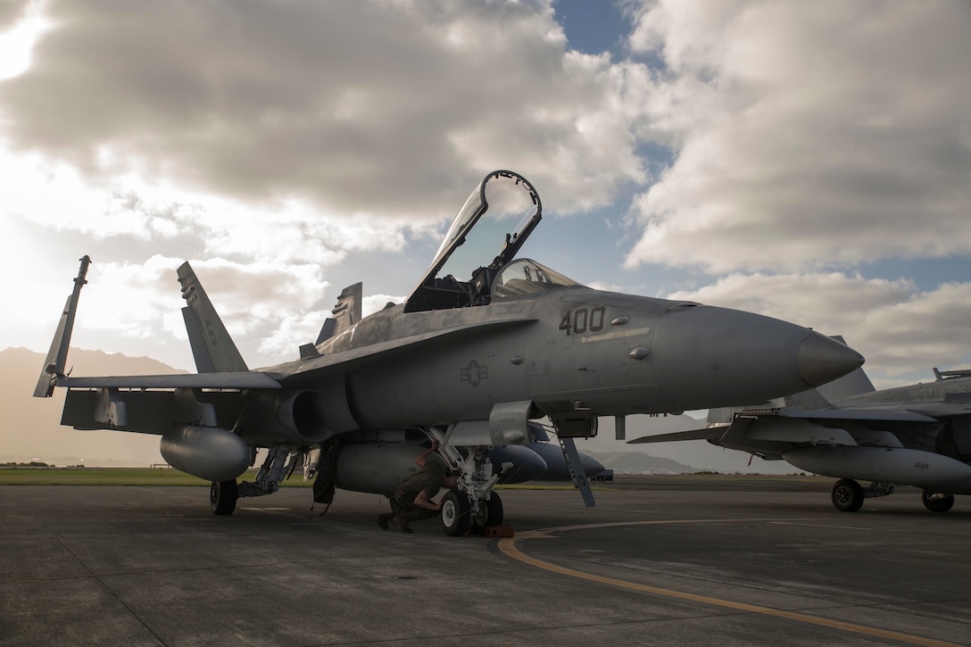 Cpl. Kory Schilling from Bremerton, Washington, checks the wheels on an F/A-18C Hornet from Marine Fighter Attack Squadron 323 Jan. 7, on here. Schilling examines the aircraft before it takes flight for Lava Viper 15.1-2. Lava Viper is a biannual exercise that enhances the joint operational skills of U.S. forces. Schilling is an F/A-18C Hornet mechanic with VMFA 323, Marine Aircraft Group 11, 3rd Marine Aircraft Wing stationed at Marine Corps Air Station Miramar, San Diego, California.