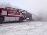 Michigan Air National Guard firefighters from the 110th Attack Wing, Battle Creek Air National Guard Base, respond to a multi-vehicle crash on the I-94 expressway near the base, Jan. 9, 2015.  