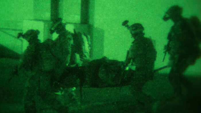 Marines evacuate a simulated casualty Jan. 10 on Camp Courtney in Okinawa, Japan. The Marines with the 31st Marine Expeditionary Unit’s Maritime Raid Force took part in a night raid as the first of three situational training events that make up the Realistic Urban Training Exercise. Expeditionary Operations Training Group, III Marine Expeditionary Force Headquarters Group, III MEF designed the training to test the MRF’s ability to respond to any contingency or crisis in the United States Pacific Command’s area of responsibility. 