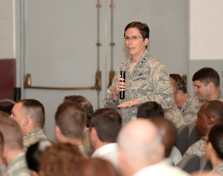 Maj. Gen. Theresa Carter, commander of the Air Force Installation and Mission Support Center (Provisional), presents information about the new unit to about 400 members of the Air Force Civil Engineer Center, Air Force Security Forces Center, Air Force Materiel Command Services Directorate and local squadrons assigned to the Air Force Installation Contracting Agency Oct. 9 at a town hall meeting in the Bob Hope Theater at Joint Base San Antonio-Lackland, Texas. (U.S. Air Force photo/Benjamin Faske)