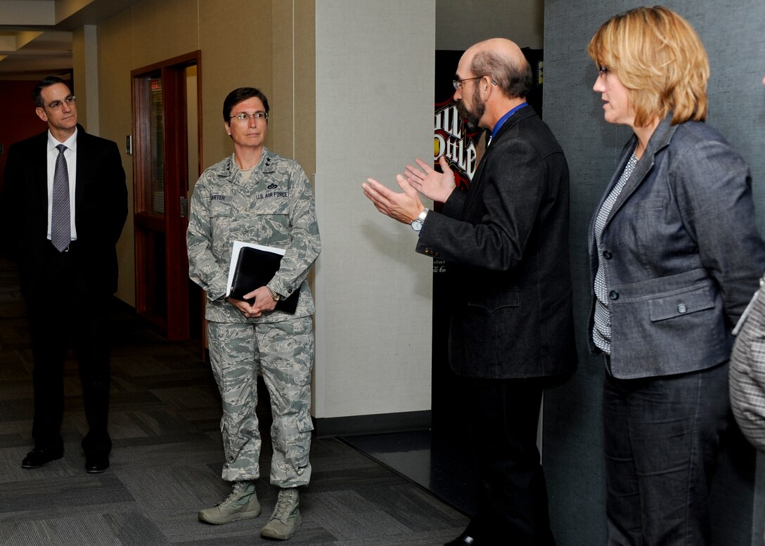 Maj. Gen. Theresa Carter, commander of the Air Force Installation and Mission Support Center (Provisional), visits with Air Force Financial Services Center Director Gary Gualano (left), Relocation Division chief Jeff Svoboda, and Audit Section chief Karen Kreutzer at Ellsworth Air Force Base, S.D., Oct 3. In addition to touring the AFFSC facility, Carter was provided information on the unit’s mission as well as a demonstration on how the unit processes vouchers and conducts its operations. (U.S. Air Force photo/Senior Airman Anania Tekurio)