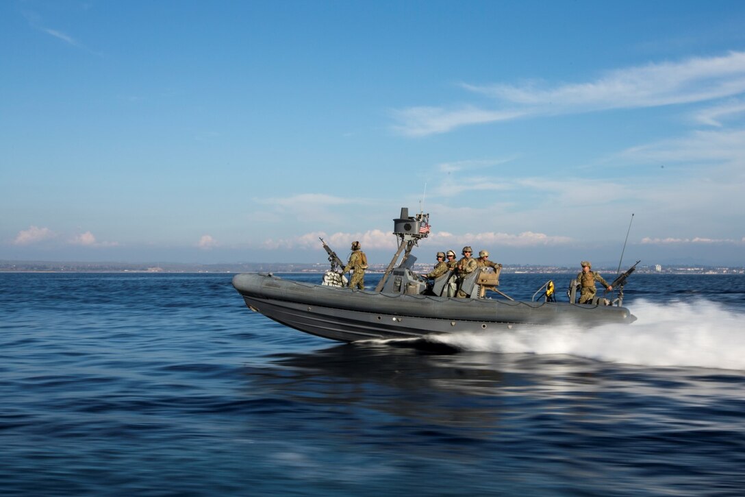 U.S. Navy Sailors and Marines with the 15th Marine Expeditionary Unit's Maritime Raid Force drive Rigid-Hulled Inflatable Boats during maritime interoperability training off the coast of Camp Pendleton, Calif., Jan. 12, 2015. MIT prepares the 15th MEU's MRF for their upcoming deployment by enhancing their combat skills and teaching them techniques for boarding vessels. (U.S. Marine Corps photo by Sgt. Jamean Berry/Released)