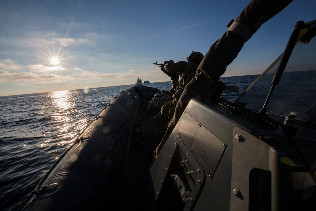 U.S. Navy Sailors and Marines with the 15th Marine Expeditionary Unit's Maritime Raid Force drive Rigid-Hulled Inflatable Boats during maritime interoperability training off the coast of Camp Pendleton, Calif., Jan. 12, 2015. MIT prepares the 15th MEU's MRF for their upcoming deployment by enhancing their combat skills and teaching them techniques for boarding vessels. (U.S. Marine Corps photo by Sgt. Jamean Berry/Released)