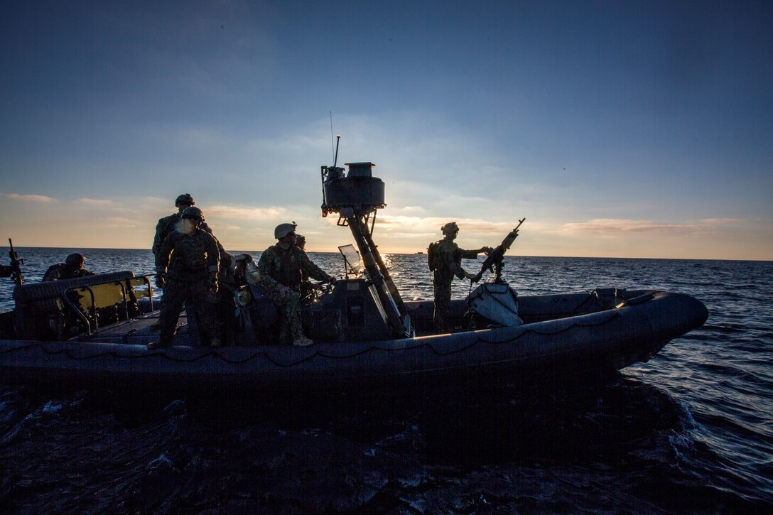 U.S. Navy Sailors and Marines with the 15th Marine Expeditionary Unit's Maritime Raid Force drive Rigid-Hulled Inflatable Boats during maritime interoperability training off the coast of Camp Pendleton, Calif., Jan. 12, 2015. MIT prepares the 15th MEU's MRF for their upcoming deployment by enhancing their combat skills and teaching them techniques for boarding vessels. (U.S. Marine Corps photo by Sgt. Jamean Berry/Released)