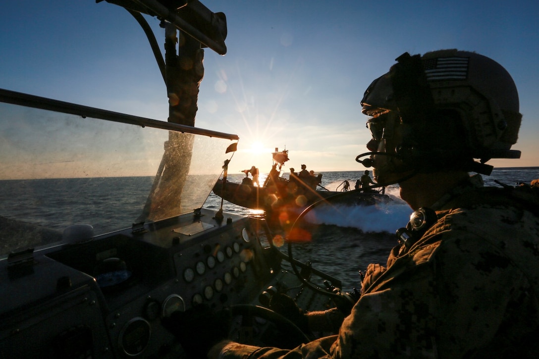 U.S. Navy Petty Officer 3rd Class Michael Mays with the 15th Marine Expeditionary Unit's Maritime Raid Force drives a Rigid-Hulled Inflatable Boat during maritime interoperability training off the coast of Camp Pendleton, Calif., Jan. 12, 2015. MIT prepares the 15th MEU's MRF for their upcoming deployment by enhancing their combat skills and teaching them techniques for boarding vessels. (U.S. Marine Corps photo by Sgt. Jamean Berry/Released)