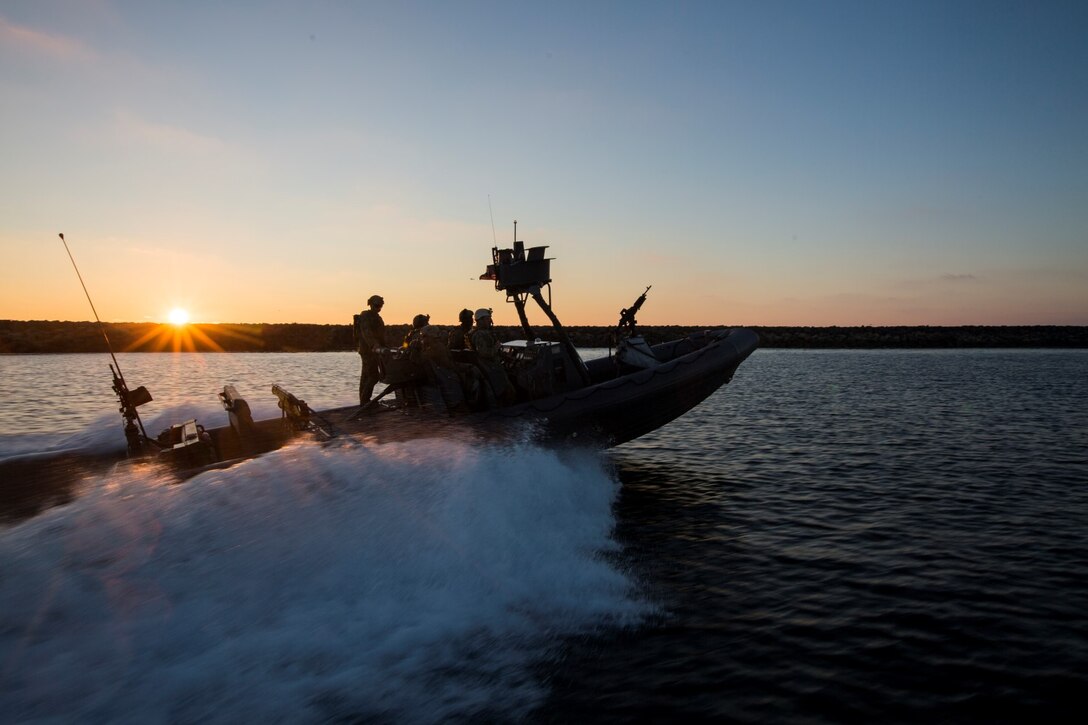 U.S. Navy Sailors and Marines with the 15th Marine Expeditionary Unit's Maritime Raid Force drive Rigid-Hulled Inflatable Boats during maritime interoperability training off the coast of Camp Pendleton, Calif., Jan. 12, 2015. MIT prepares the 15th MEU's MRF for their upcoming deployment by enhancing their combat skills and teaching them techniques for boarding vessels. (U.S. Marine Corps photo by Sgt. Jamean Berry/Released)