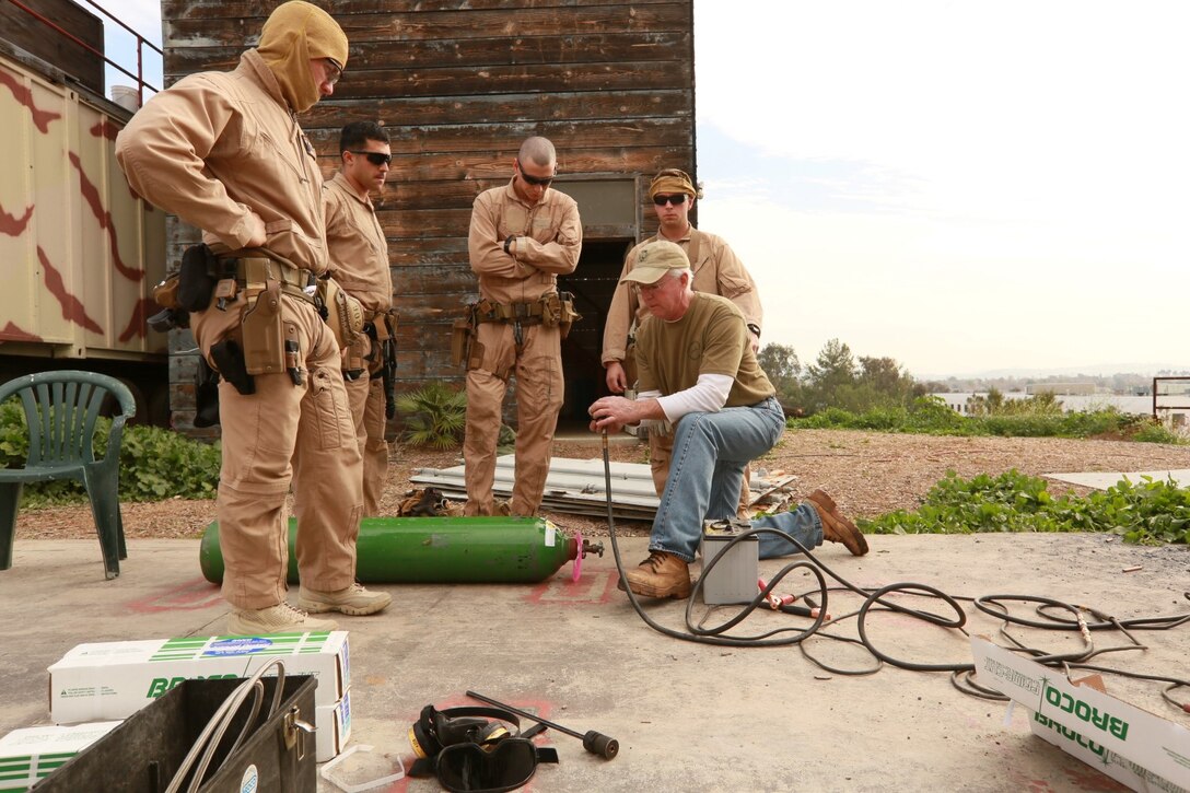 U.S. Marines with the 15th Marine Expeditionary Unit's Maritime Raid Force receive training during maritime interoperability training at Stu Segal production studio in San Diego Jan. 9, 2015. MIT prepares the MRF for its upcoming deployment, enhancing their combat skills, and teaching them techniques for boarding vessels. (U.S. Marine Corps photo by Sgt. Jamean Berry/NOT Released)