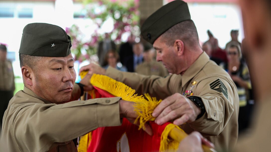Brigadier Gen. Daniel D. Yoo, commanding general of Marine Expeditionary Brigade – Afghanistan, and Sgt. Maj. Doug Berry Jr., MEB-A sergeant major, prepare to case the organizational colors at a deactivation ceremony for MEB-A aboard Camp Pendleton, Calif., Jan. 9; symbolically closing another chapter in Marine Corps history following the 13-year conflict known as Operation Enduring Freedom. Marine Expeditionary Brigade - Afghanistan officially took authority of Regional Command (Southwest) from II Marine Expeditionary Force (Forward) Feb. 5, 2014, and assumed the responsibility to lead coalition operations in Helmand and Nimroz provinces. The Marines completed operations and departed Afghanistan Oct. 27, 2014.