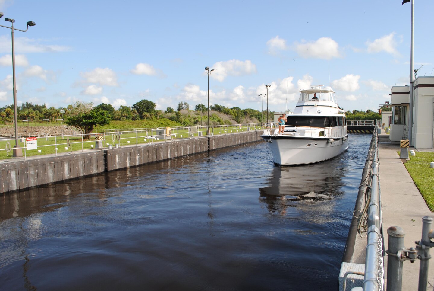A boat navigates through the St. Lucie Lock & Dam near Stuart.  The U.S. Army Corps of Engineers is taking comments on a proposal to reduce operating hours of the St. Lucie Lock and four others on the Okeechobee Waterway.