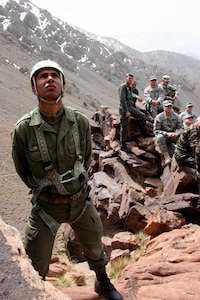 A Morroccan Soldier watches as Utah National Guard members from the 19th Special Forces Group train with the 1st Ski Battalion of the Royal Morroccan Armed Forces in March. At 10,000 feet, the altitude of the training location, the focus of the exercise was on disaster preparedness, snow movement and mountain-rescue techniques.