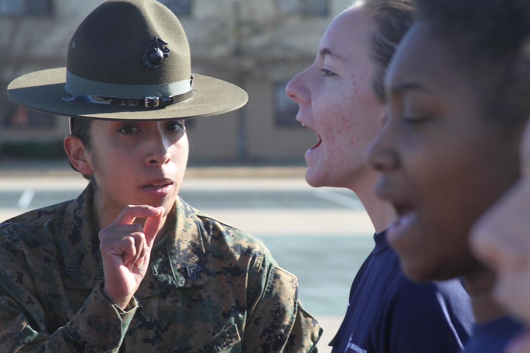 Sgt. Elena Jaramillo Bell, a drill instructor from Parris Island, corrects poolees during Montgomery's Quarterly Pool Function.