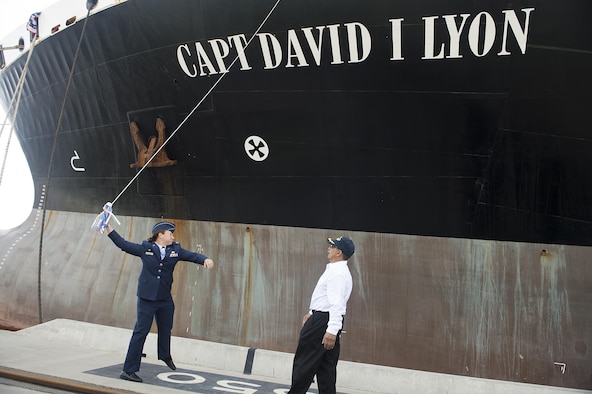 Capt. Dana M. Lyon, widow of Capt. David I. Lyon, prepares to break a champagne bottle on the hull of the Motor Vessel Capt. David I. Lyon during a christening and ship visit, Aug. 11, 2014, at Military Ocean Terminal Sunny Point, Southport, N.C. The MV Capt. David I. Lyon is an Air Force prepositioning vessel named in honor of Capt. David I. Lyon, an Air Force logistics readiness officer and 2008 U.S. Air Force Academy graduate who was killed in action Dec. 27, 2013, in Afghanistan. The vessel will transport critical war reserve materiel to locations around the globe. (U.S. Air Force photo/Tech. Sgt. Jason Robertson)     
   