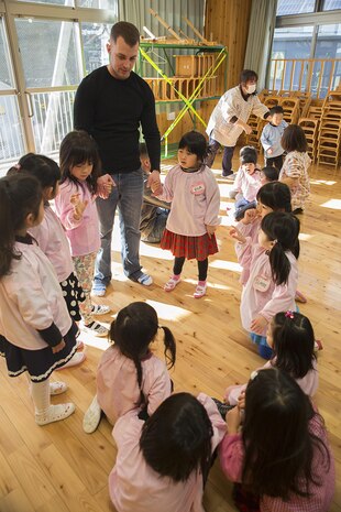 Service members from Marine Corps Air Station Iwakuni, Japan, visited Josho Hoikuen in Iwakuni City during a community relations preschool event hosted by the Marine Memorial Chapel, Jan. 13, 2015. Volunteers visited the school to teach the children English to strengthen the bond between the U.S. and Japan.