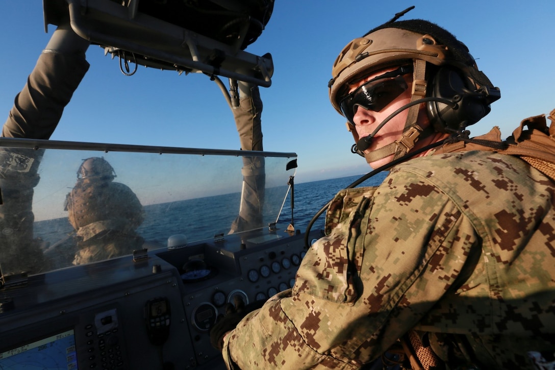 U.S. Navy Petty Officer 3rd Class Michael Mays with the 15th Marine Expeditionary Unit's Maritime Raid Force drives Rigid-Hulled Inflatable Boats during maritime interoperability training off the coast of Camp Pendleton, Calif., Jan. 12, 2015. MIT prepares the 15th MEU's MRF for their upcoming deployment by enhancing their combat skills and teaching them techniques for boarding vessels. (U.S. Marine Corps photo by Sgt. Jamean Berry/Released)