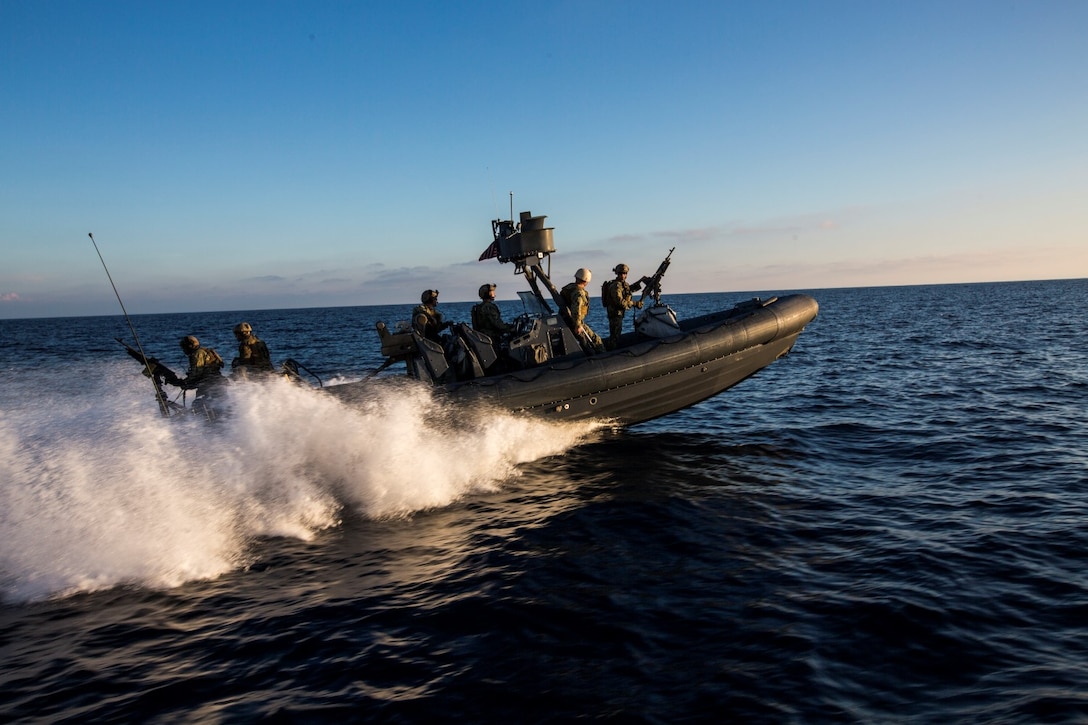 U.S. Navy Sailors and Marines with the 15th Marine Expeditionary Unit's Maritime Raid Force drive Rigid-Hulled Inflatable Boats during maritime interoperability training off the coast of Camp Pendleton, Calif., Jan. 12, 2015. MIT prepares the 15th MEU's MRF for their upcoming deployment by enhancing their combat skills and teaching them techniques for boarding vessels. (U.S. Marine Corps photo by Sgt. Jamean Berry/Released)