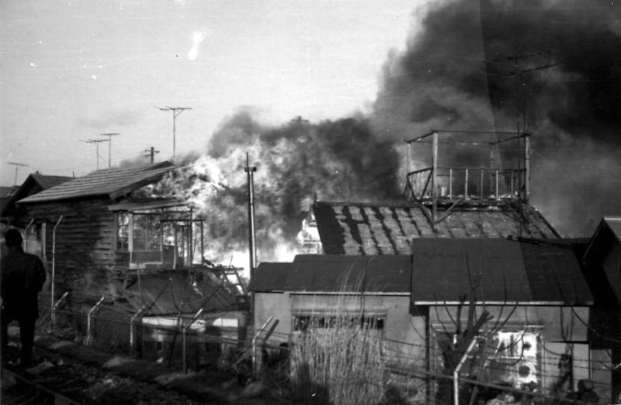 Fire destroys a Japanese bar just outside of the Misawa Air Base perimeter on January 11, 1966.
