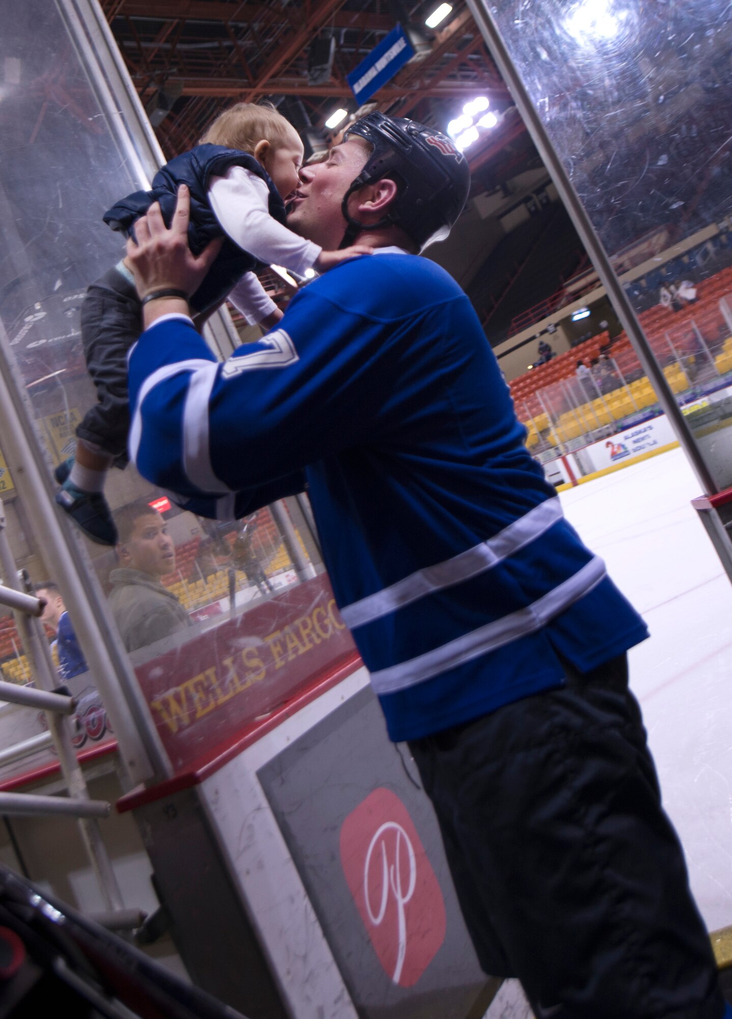 Robert Dubinsky, Air Force forward, kisses his son Brayton
after the 2015 Army vs. Air Force hockey game at the
Sullivan Arena in Anchorage, Alaska, January 9, 2015.
The goal of the game was to promote esprit de corps and
enhance the relationship between JBER and the
Anchorage community. The Air Force team won the game
seven to five. (U.S. Air Force photo/Staff Sgt. Sheila
deVera)