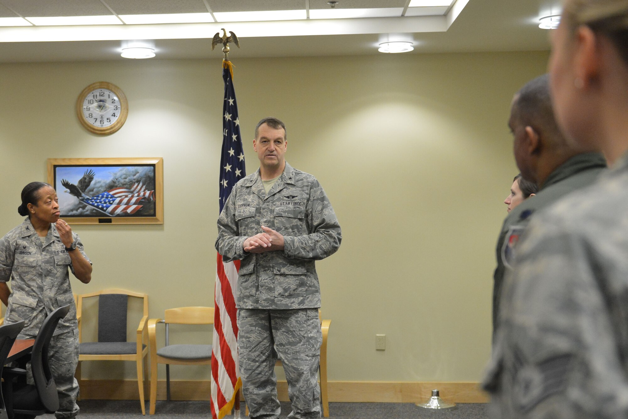 Brig. Gen. Kory Cornum (center), Air Mobility Command surgeon general, speaks with members of the 62nd Medical Squadron Jan. 14, 2015, at Joint Base Lewis-McChord, Wash. Airmen of the 62nd MDS distinguished themselves by winning two 2014 AMC awards for the Personnel Reliability Program on an individual and team basis. (U.S. Air Force photo/Senior Airman Rebecca Blossom)