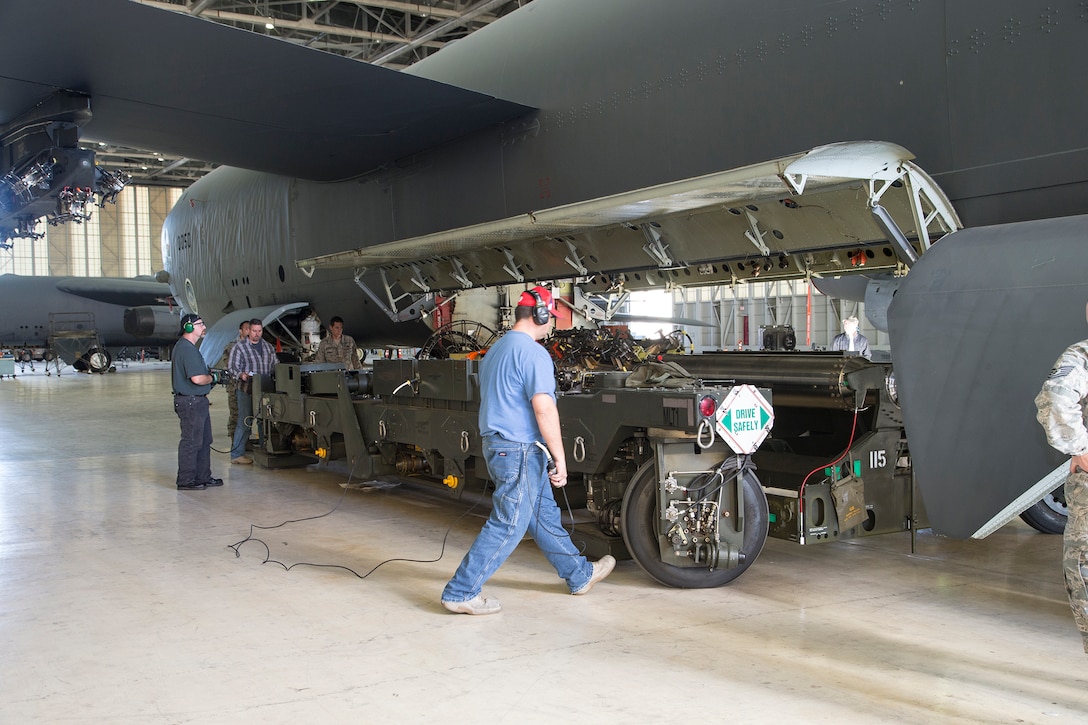 Team members from the 419th Flight Test Squadron, the Global Power Bomber Combined Test Force and Boeing installed a Conventional Rotary Launcher on an Edwards B-52H this past December. The upgrade modifies the internal weapons bay of the B-52H bomber by integrating a CRL that has the capability of carrying Military Standard 1760 “smart weapons. (U.S. Air Force photo by Bobbi Zapka)