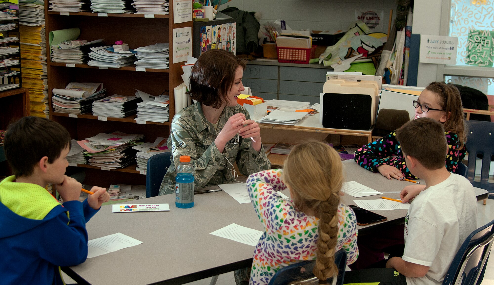 Airman Ciara Charles, 90th Medical Operations Squadron family health front desk attendant at F.E. Warren Air Force Base, Wyo., speaks with fourth grade students at Freedom Elementary School about her life before the military Jan. 13, 2015. Charles volunteered to be a part of the school’s annual Living Histories Project, where students interview people from the community and then create art projects based on their stories. (U.S. Air Force photo/Airman 1st Class Brandon Valle)