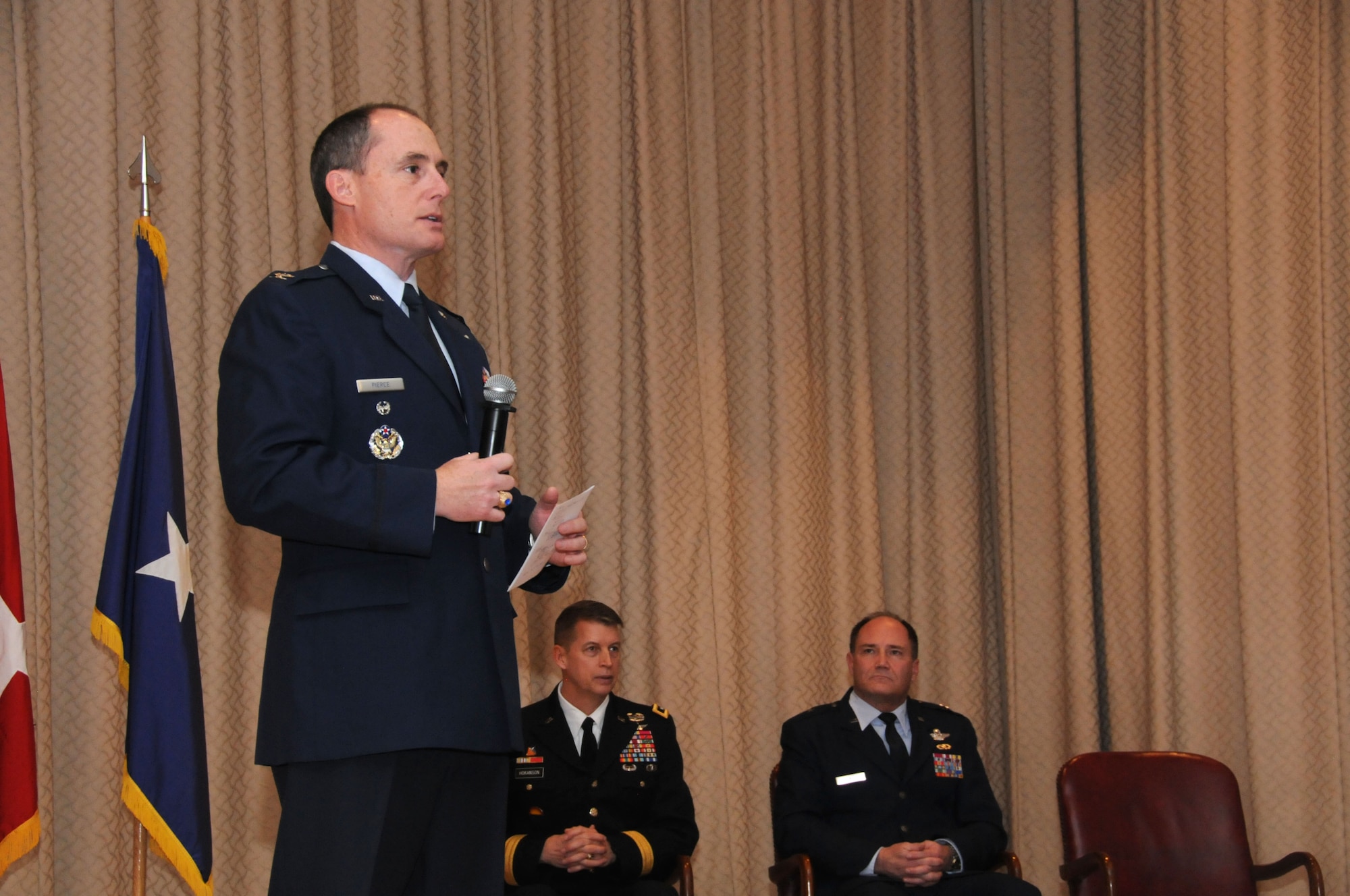 U.S. Air Force Colonel Kirk Pierce, 173rd Fighter Wing Commander, speaks to the audience about his vision for the future of the wing during an Assumption of Command ceremony at Kingsley Field, Klamath Falls, Ore. Jan. 10, 2015.  Pierce has 26 years of military service and was previously assigned as the Director of Plans and Programs for the National Guard Bureau. (U.S. Air National Guard photo by Senior Airman Penny Snoozy/Released)