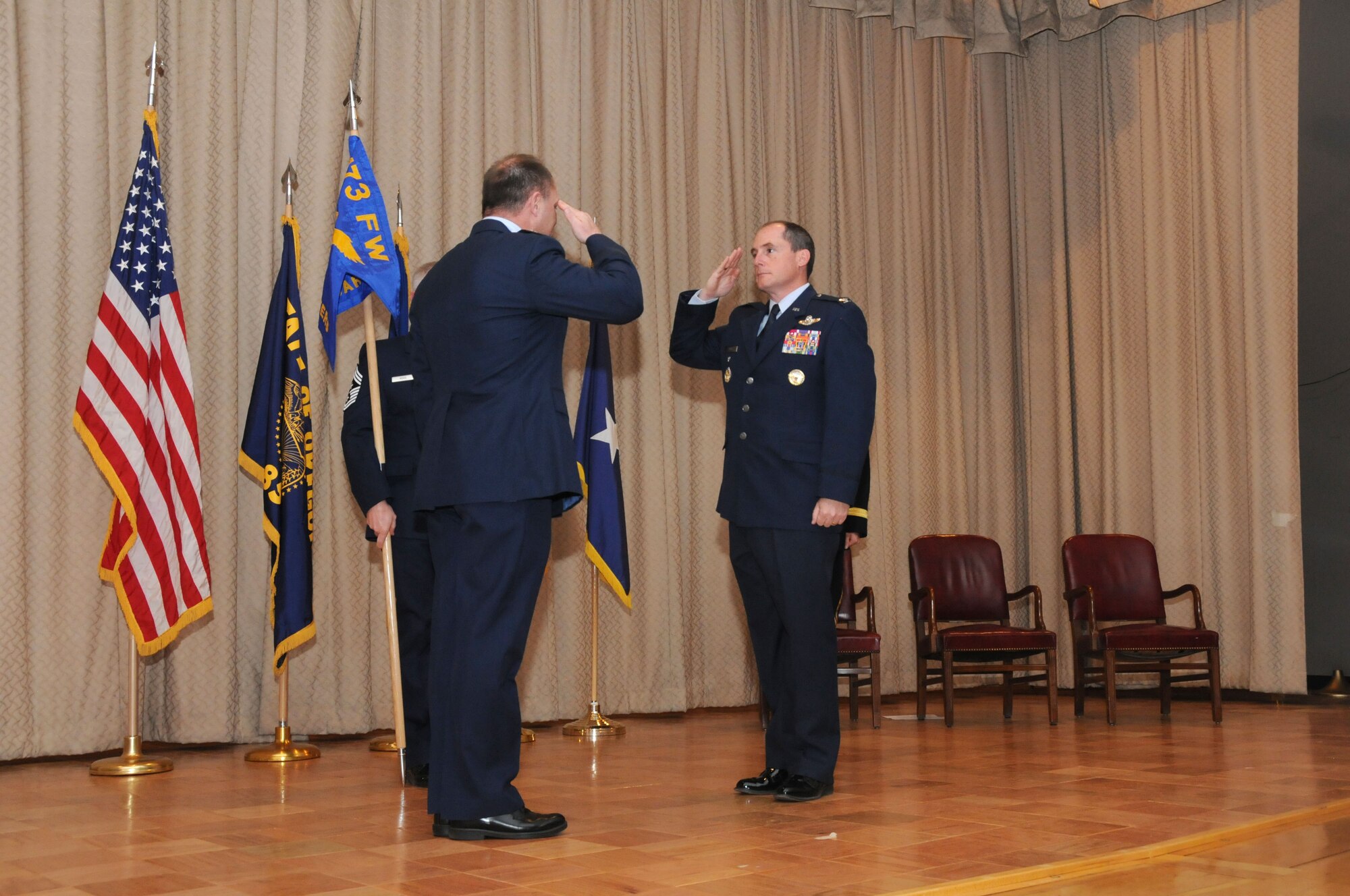 U.S. Air Force Colonel Kirk Pierce, the incoming 173rd Fighter Wing Commander, salutes Brigadier General Michael Stencel, Oregon Air National Guard Commander, presents the during an Assumption of Command ceremony at Kingsley Field, Klamath Falls, Ore. Jan. 10, 2015.  Pierce has 26 years of military service and was previously assigned as the Director of Plans and Programs for the National Guard Bureau. (U.S. Air National Guard photo by Senior Airman Penny Snoozy/Released)