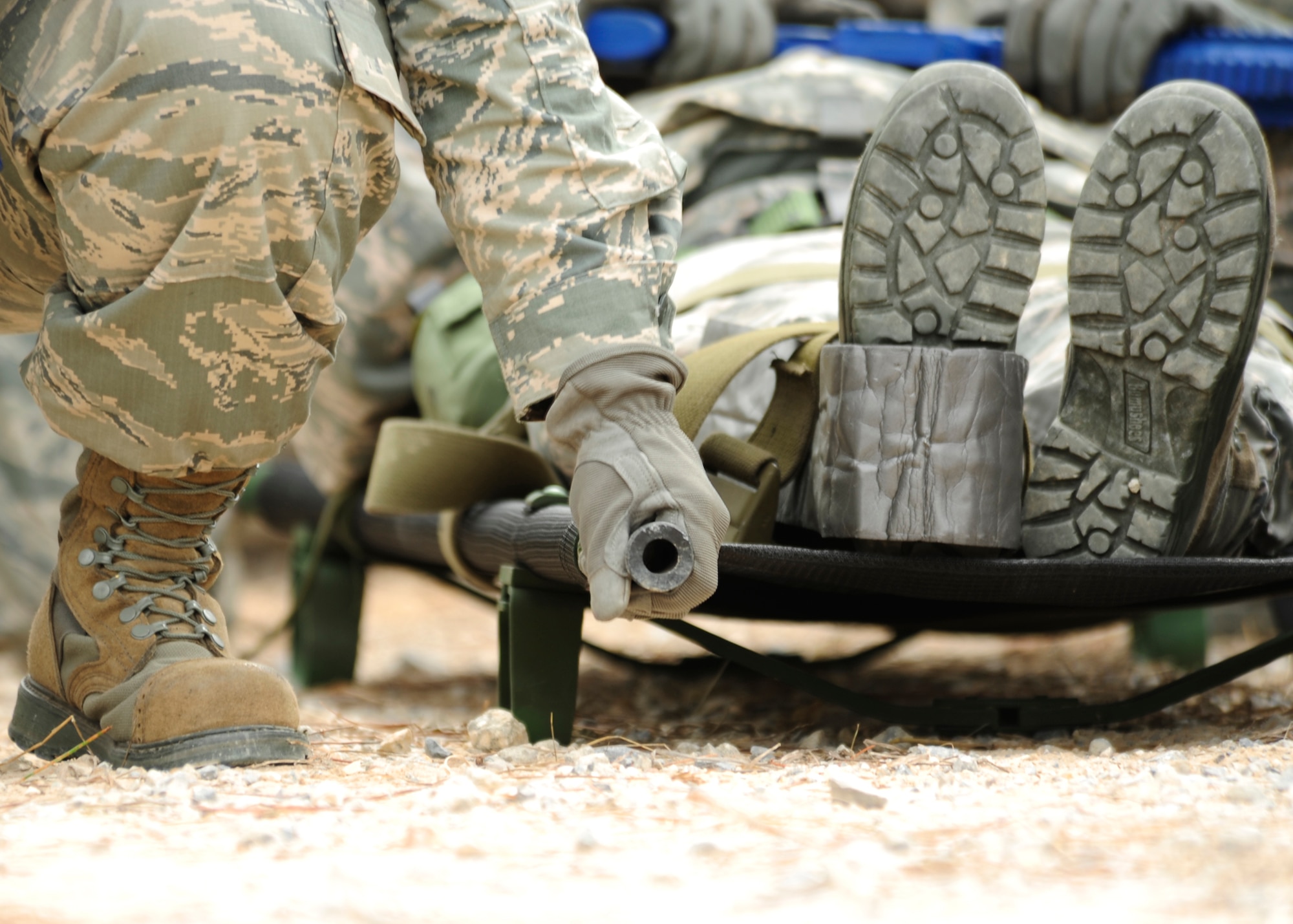 Members of the 325th Logistics Readiness Squadron go through medical evacuation situations during convoy training Jan. 14 in Tyndall’s Silver Flag area. The 325th LRS conducted its first convoy training to simulate situations that vehicle operators would experience during a deployment. (U.S. Air Force photo by Airman 1st Class Solomon Cook)