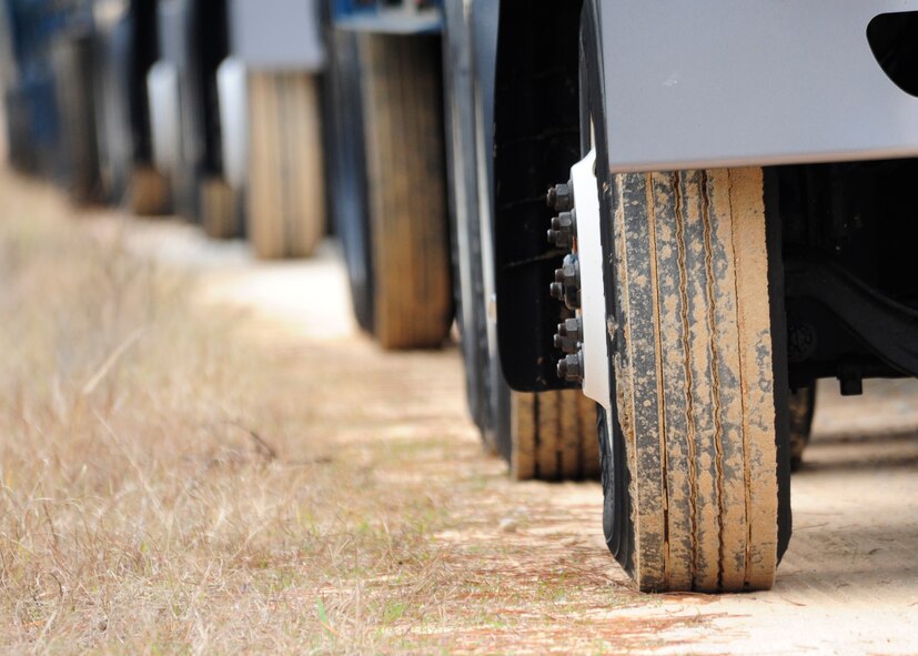 A convoy drives down a dirt road Jan. 14 in Tyndall’s Silver Flag area. The 325th Logistics Readiness Squadron conducted its first convoy training to simulate situations that vehicle operators would experience during a deployment. (U.S. Air Force photo by Airman 1st Class Solomon Cook)