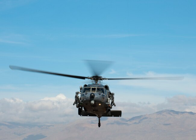 A U.S. Air Force HH-60G Pave Hawk assigned to the 66th Rescue Squadron takes off for a training exercise at Nellis Air Force Base, Nev., Jan. 12, 2015. The 823rd Maintenance Squadron is responsible for maintaining the aircraft and ensuring they are mission ready for the 66th and 58th Rescue Squadrons to carry out their combat search and rescue operations. (U.S. Air Force photo by Senior Airman Thomas Spangler)