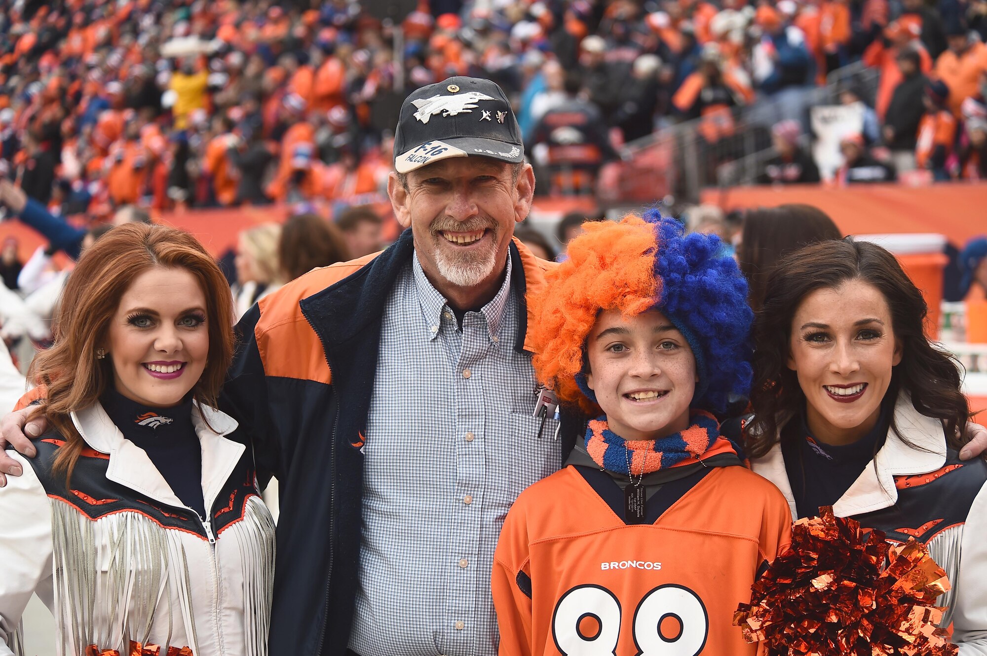 The family of Capt. William H. DuBois, a pilot who tragically lost his life while deployed, was honored before the Denver Broncos playoff game Jan. 11, 2015, at Sports Authority Field in Denver with the presentation of the game ball before the opening kickoff. (U.S. Air Force photo by Airman 1st Class Luke W. Nowakowski/Released)