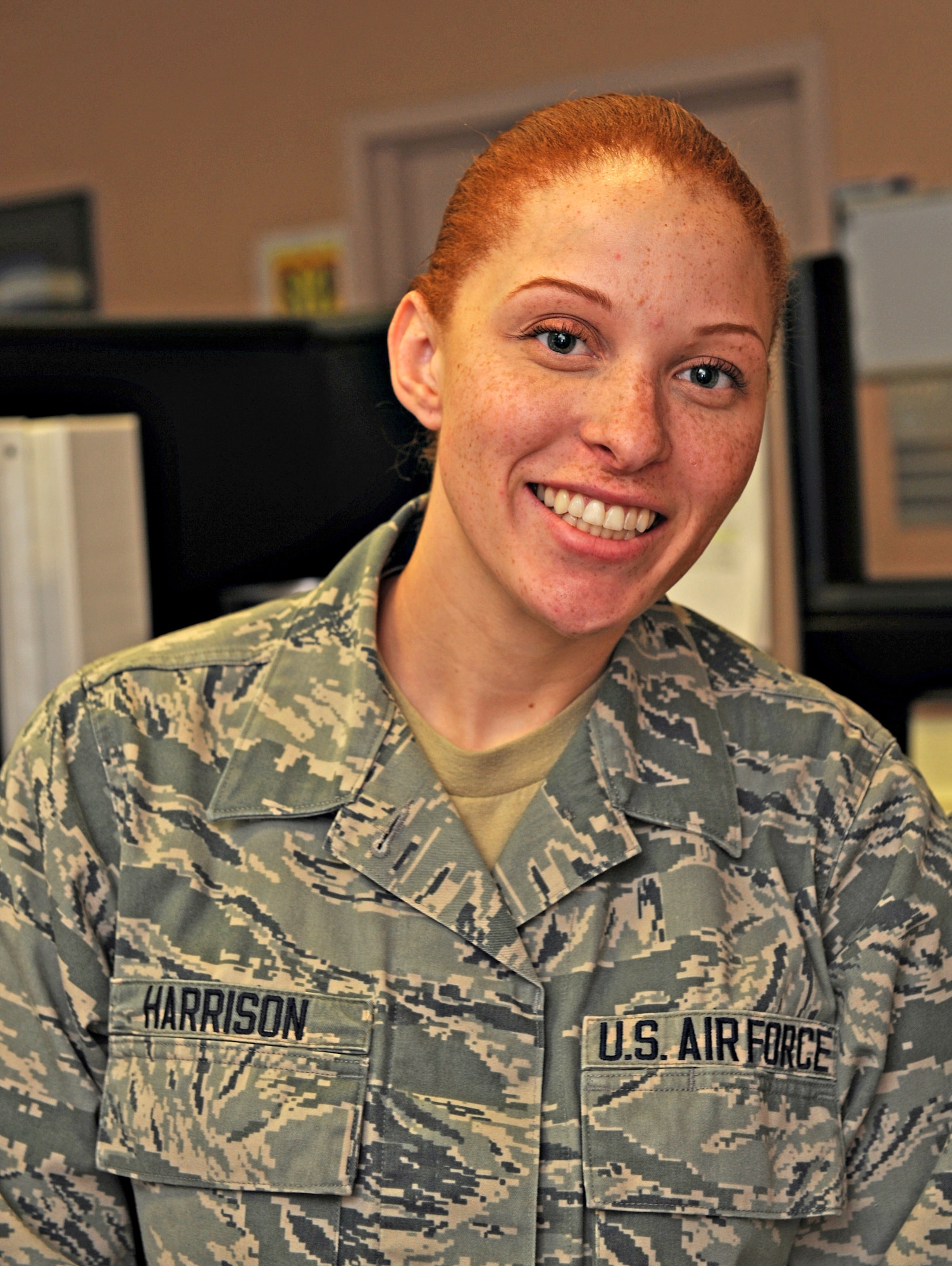 Airman 1st Class Shauna Harrison, 9th Comptroller Squadron special actions technician, poses at her desk at Beale Air Force Base, Calif., Jan. 14, 2015.(U.S. Air Force photo by Airman 1st Class Ramon A. Adelan/Released)