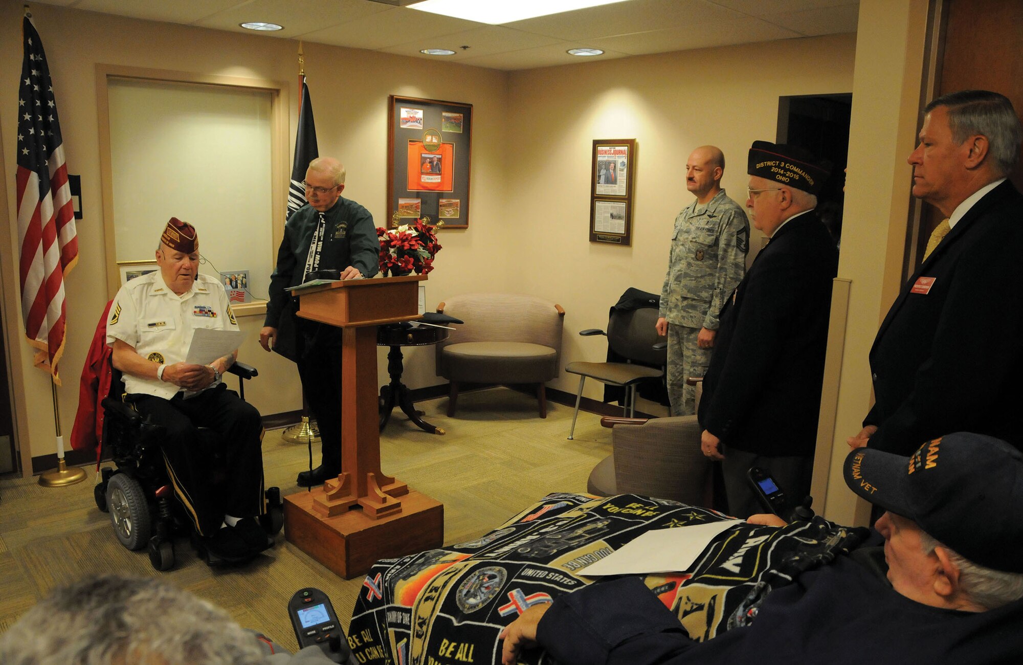 DAYTON, Ohio - Army veteran Sergeant 1st Class Harley Coon gives a speech prior to a flag raising ceremony at the Dayton VA Medical Center's Holiday Party December 6, 2014.  Sergeant Coon was instrumental in acquiring a flag pole for the courtyard of the building in which he resides. The flagpole was donated by the Air Force Sergeants Association Kittyhawk Chapter 751 located at Wright-Patterson Air Force Base. (U.S. Air Force photo/Tech. Sgt. Anthony Springer)