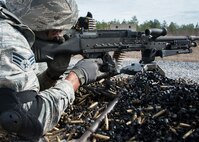 Senior Airman Kendrick Woodson, 919th Special Operations Security Forces Squadron, fires the M240-B during the heavy weapons qualification firing Jan 10, 2015 at Duke Field, Fla.  (U.S. Air Force photo/ Tech. Sgt. Jasmin Taylor)