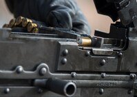 An Airman assigned to the 919th Special Operations Security Forces Squadron reloads the M240-B to complete heavy weapons qualification firing Jan 10, 2015 at Duke Field, Fla.  (U.S. Air Force photo/ Tech. Sgt. Jasmin Taylor)